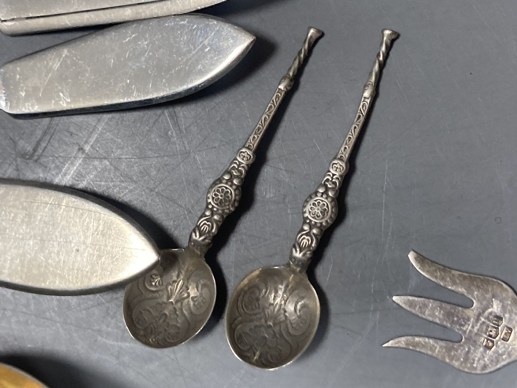 A group of assorted Chinese white metal spoons and forks, including set of six teaspoons and ten small items of English silver.